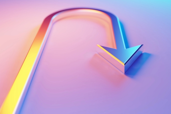 A metallic u-turn symbol with an arrow head, which is illuminated by blue and magenta lights on a blue and magenta background